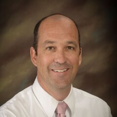 A portrait photo of John Poole