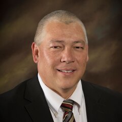 A portrait photo of Chris Andrews