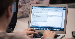A student learns about Data Wrangling on his computer.