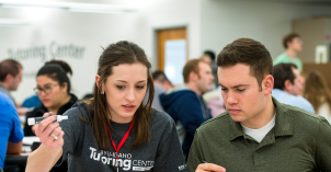 A Tutoring Center tutor discusses a class concept with a BYU-Idaho student.