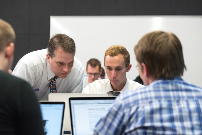 A professor teaches his students about Data Wrangling.