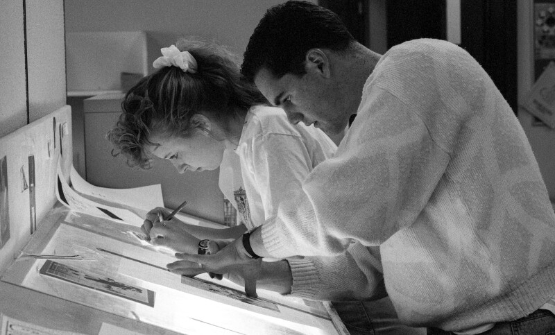 Students work to create the Scroll, the University Newspaper.