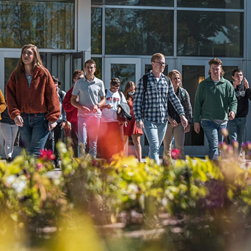 A group of BYU-Idaho students safely exit the Manwaring Center during a class change.
