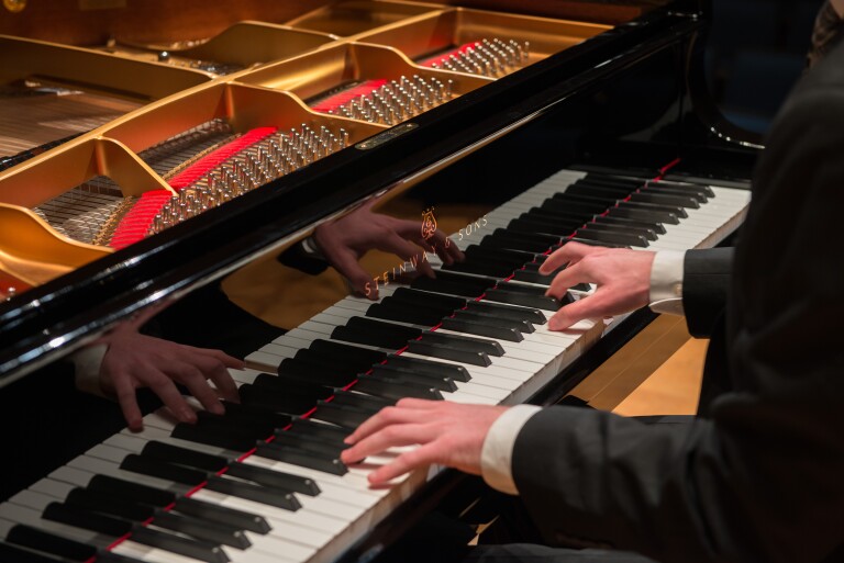 Doug Rowen, a music major enjoys the opportunity to practice on the Hamburg Steinway Piano in the Barrus Concert Hall.
