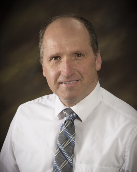 A professional photo of David W. Allen.