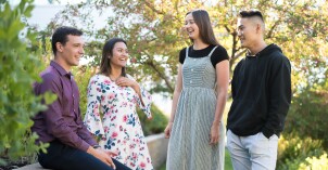 A group of students talking with one another.