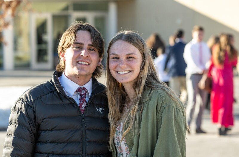 A couple smiling at the camera