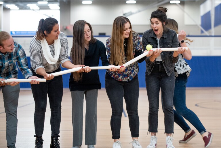 Student Support employees participate in team-building activities in the Hart Gym.