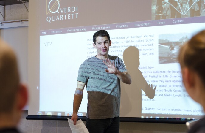 A student gives a presentation in front of a Humanities Class.