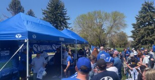 Fans wait in a long line to meet BYU Football Players, and Coach Sitaki