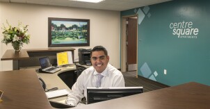 Student employee waits to assist students at the Centre Square front desk