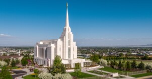 A southeast view of the Rexburg Idaho Temple with BYU-Idaho campus and University Village in the background.