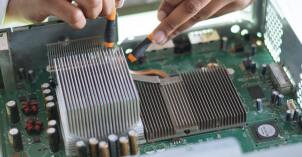 A BYU-Idaho student tests a motherboard during a Computer Engineering internship.