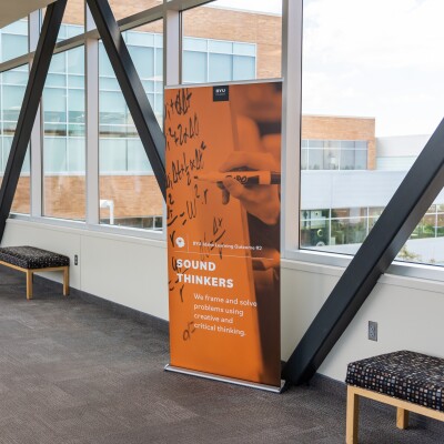 A BYU-Idaho advertising sign in the walkway between the McKay library and the Manwaring Center