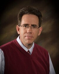 A portrait photo of Eric J. Gee.