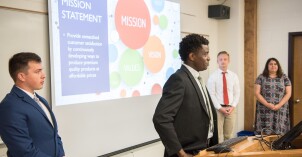 Dave Harrell, a faculty member of the Finance Department teaches BA 215, Business Essentials.  That day the class was presenting their final group project.