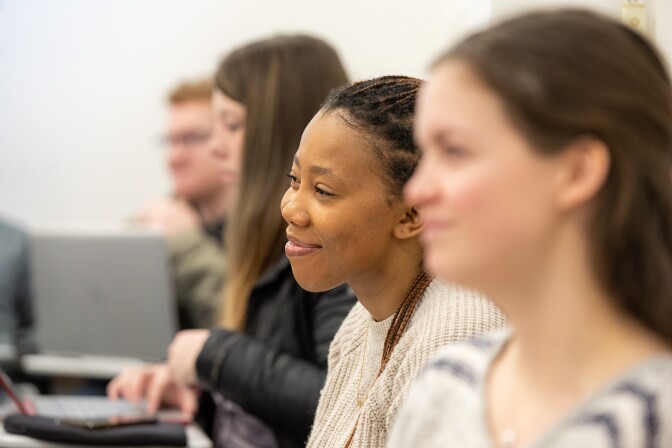 Students sit in a Social Work class.
