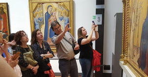 A BYU-Idaho professor and students study historic European paintings
