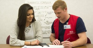 A math tutor helping a student with math homework