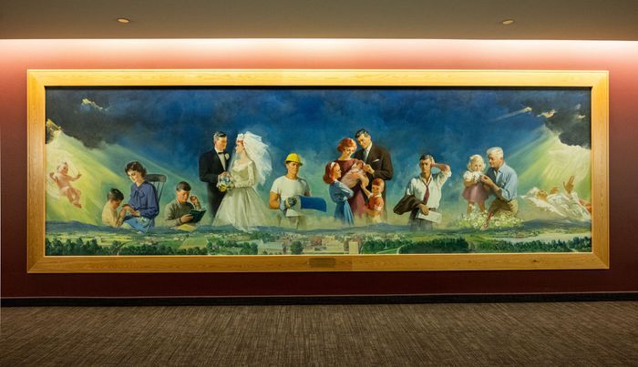 Photo of the Purpose of Life Display in the BYU-Idaho Center. The painting shows a persons journey thru life, from birth to death.
