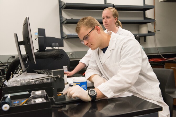 Two students working in the Food Science Instrument Room