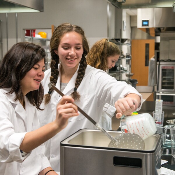 Students in the food science department work in the Processing Lab.