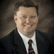 A professional photograph of Tyler Williams, Director of Concurrent Enrollment.