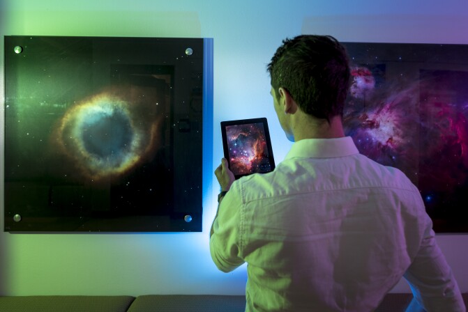 A student views stars from the observatory in the Romney Building.