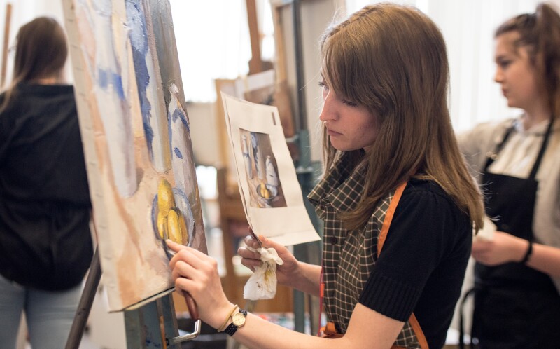 Student Riley Haycock at an Oil Painting class taught by Brother Gerald Griffin.