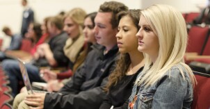 Students listening to devotional.