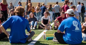 New students play activities on the Stadium Field and meet their new mentors.