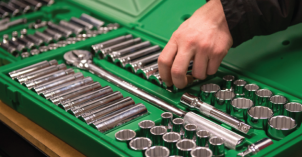A green box of mechanic tools.