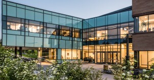 The Science Technology Center lit up at dusk.