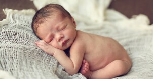 newborn-baby-on-white-cloth.jpg