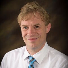 A portrait photo of Trevor Brooks.