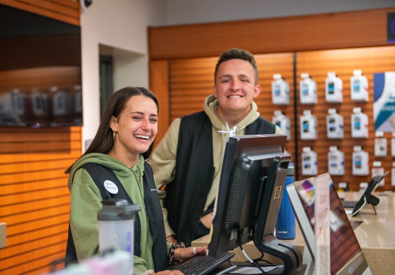 Student employees working in the tech center at the University Store.