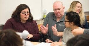 Brother Tyler Watson explains Math Concepts to the students in his Epidemiology Class.