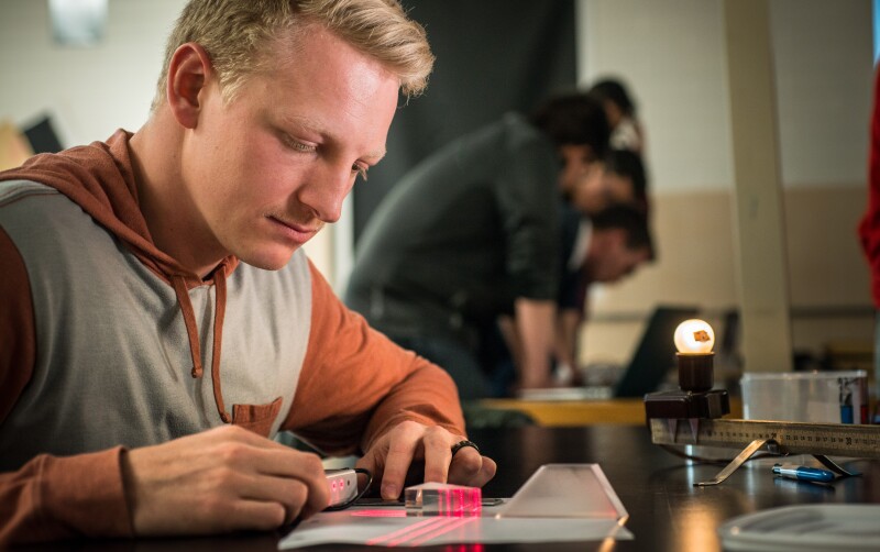 Austin Johnson studying light refraction through a prism. Feb 2018