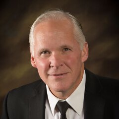 A portrait photo of Brian Merrill.