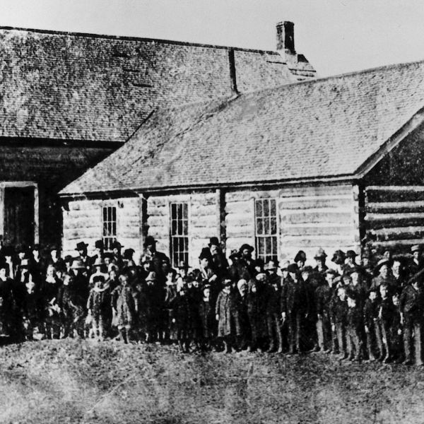 Pioneer photograph of original Bannock Stake Academy Building in 1891 with teachers and students