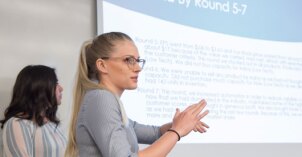 A student gives a presentation in Business Analytics.
