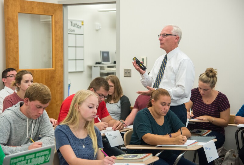 Greg Hazard helps new freshman learn how to be better learners in a Study Skills class.