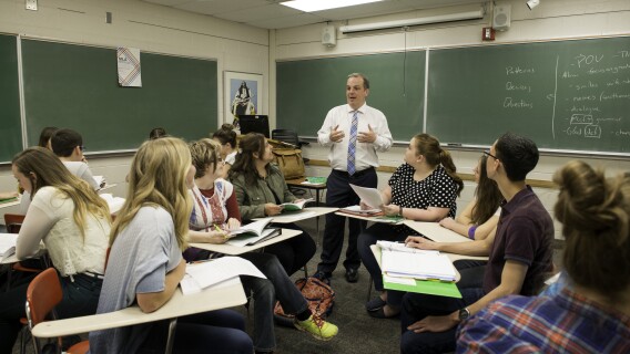 An English instructor teaches a literary interpretation class.
