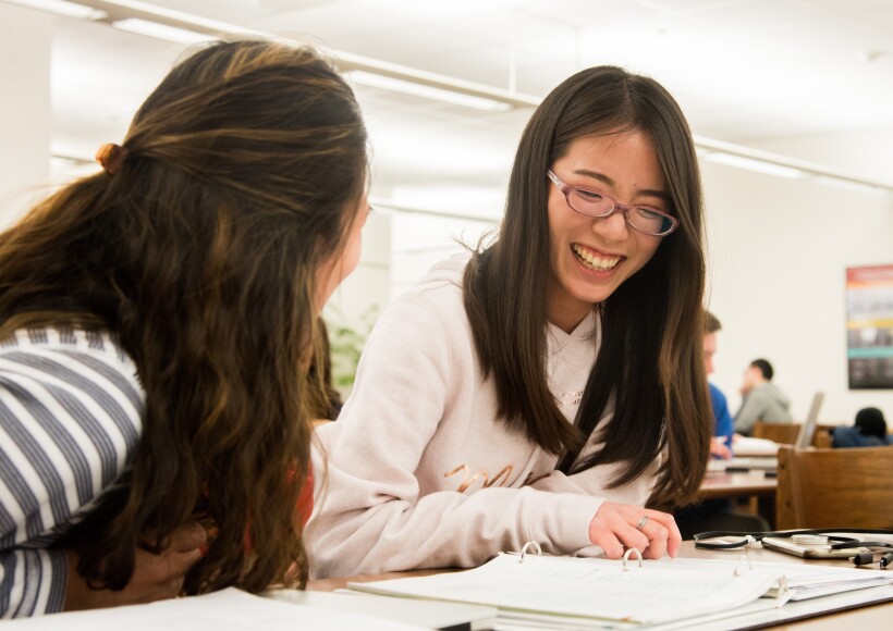 Students preparing for their exam at the Math Lab with a tutor