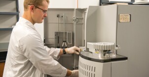 A male food Science student working with machines in the Instrument Room.