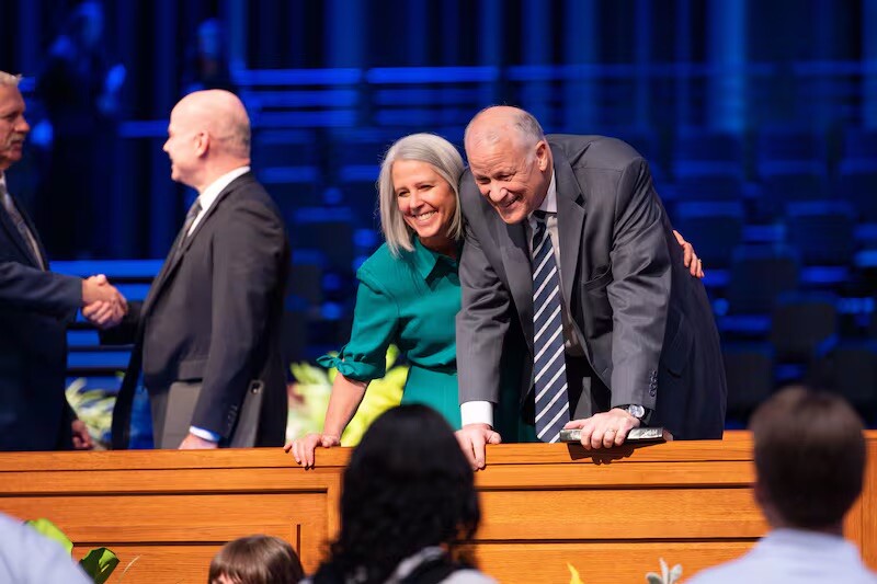 General Authority Seventy Elder David P. Homer, right, and his wife, Sister Nancy D. Homer, interact with students at BYU–Idaho devotional in Rexburg, Idaho, on May 20, 2025.