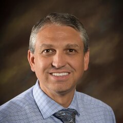 A portrait photo of Mark Farnsworth