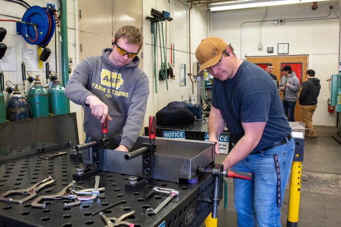 Students working on a project in the shop