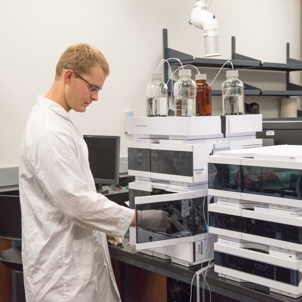 A man using the Agilent High Performance Liquid Chromatograph (HPLC)
