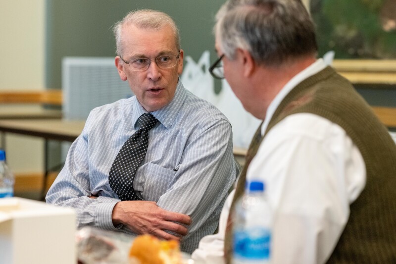 Two faculty members talking together